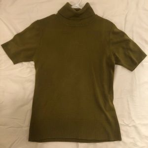 Green turtle neck short sleeve shirt.